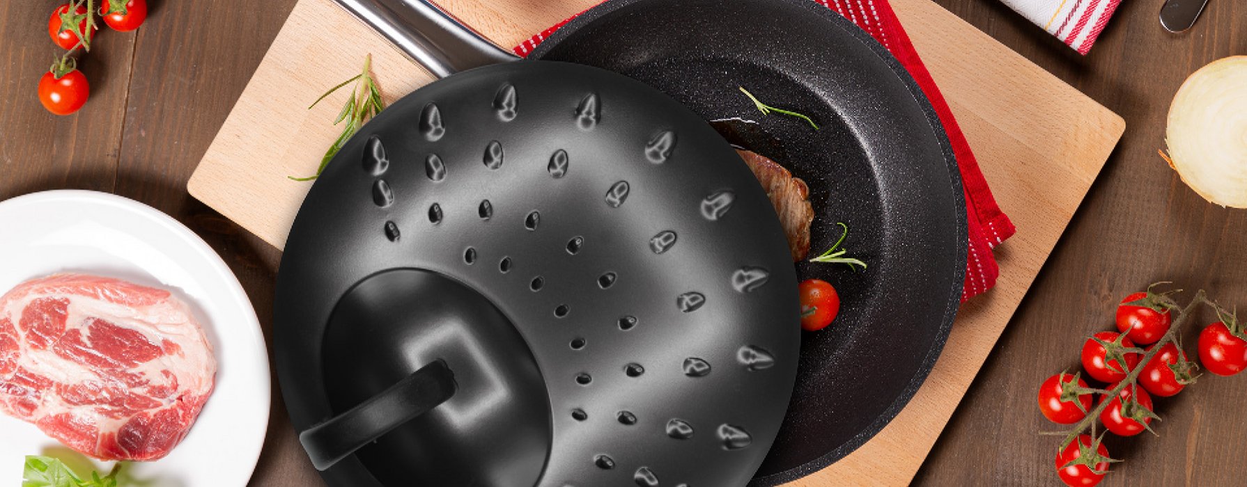 Black splash guard lid of a pan on a frying pan with meat and vegetables