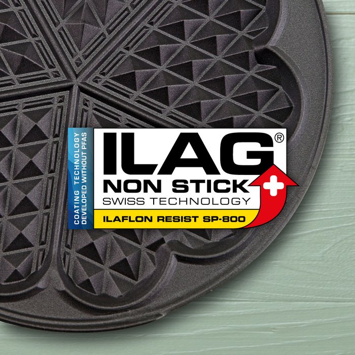 Black coated iron for heart shaped waffles - ILAG logo with yellow shaded lettering Ilaflon Resist SP-800 lettering in the center and on the left hand side an extra labeling "PFAS-FREE" in blue