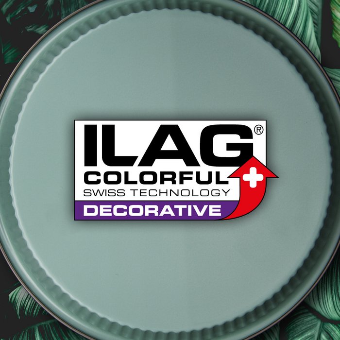 Raseda green outside of a round baking tray with wavy edge - ILAG logo with purple shaded Decorative lettering in the center