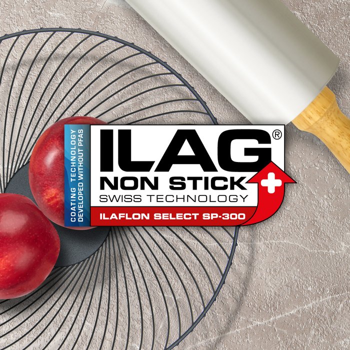 Black metal fruit basket and a aluminium colored rolling pin - ILAG logo wiht red shaded Ilaflon Select SP-300 lettering in the center and on the left hand side an extra labeling "PFAS-FREE" in blue