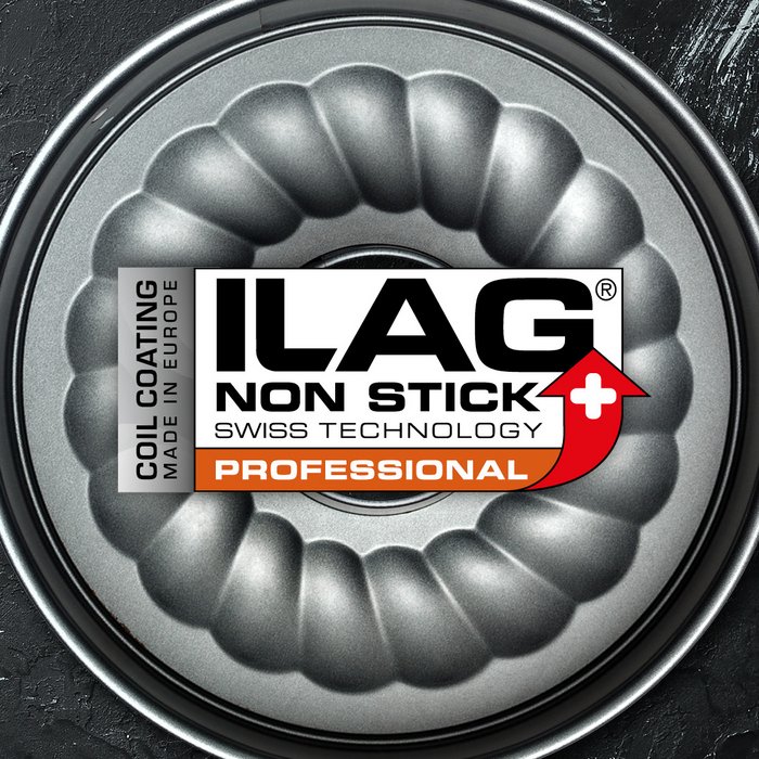 Silver grey coated inside of a round cake pan with bulges - ILAG logo with grey shaded Essential lettering and on the left hand side an extra labeling "Coil Coating-Made in Europe"